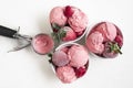 Raspberry ice cream and frozen berries on white table. Homemade dessert Royalty Free Stock Photo