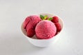 Raspberry ice cream scoop with fresh raspberries in bowl Royalty Free Stock Photo