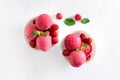 Raspberry ice cream scoop with fresh raspberries in white bowl Royalty Free Stock Photo