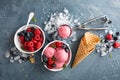 Raspberry ice cream in white bowl