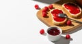 Raspberry Jam on Bread with Fresh Berries and Spoon - Delicious Breakfast Food Royalty Free Stock Photo