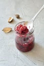 Raspberry jam close up in a glass jar