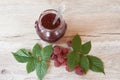 Raspberry jam with fresh raspberries and leaves. marmalade in jar with silver spoon Royalty Free Stock Photo
