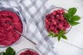 Raspberry jam making. berries and leaves Royalty Free Stock Photo