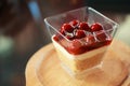 Raspberry jam sweet dessert, cheesecake, trifle, mousse snack in a cocktail glass on a wooden tray background. Festive layered Royalty Free Stock Photo