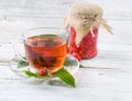 Raspberry jam and tea in cup Royalty Free Stock Photo