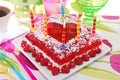 Raspberry jelly cake with birthday candles