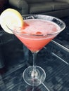 Raspberry lemon drop martini.. perfect cool refreshing cocktail with slice of lemon garnish