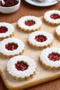 Raspberry Linzer Torte Cookies on Cutting Board Royalty Free Stock Photo
