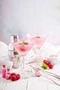 Raspberry martini on white table Royalty Free Stock Photo
