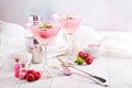 Raspberry martini on white table Royalty Free Stock Photo
