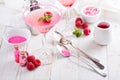 Raspberry martini on white table Royalty Free Stock Photo