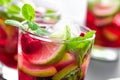 Raspberry mojito cocktail with lime, mint and ice, cold, iced refreshing drink Royalty Free Stock Photo