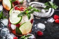 Raspberry Mojito Lemonade with lime and fresh mint in glass on gray background. Summer refreshing cocktail Royalty Free Stock Photo