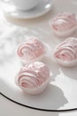 Raspberry pink marshmallows on light background