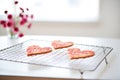 raspberry raw cake hearts on cooling rack