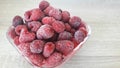 Raspberry ripe frozen in a glass bowl