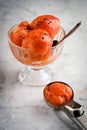 Raspberry sherbet in a glass on a marble table. Royalty Free Stock Photo