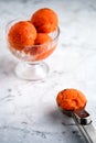 Raspberry sherbet in a glass on a marble table. Royalty Free Stock Photo