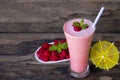 Raspberry smoothies yogurt juice and raspberry fruit for weight loss drink on a wood background. Royalty Free Stock Photo