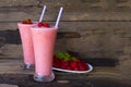 Raspberry smoothies yogurt juice and raspberry fruit for weight loss drink on a wood background. Royalty Free Stock Photo