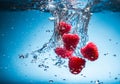 Raspberry splash in water