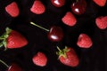 Raspberry, strawberry, cherry fruit pattern on black background Royalty Free Stock Photo