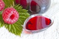 Raspberry syrup on spoon alternative medicine Royalty Free Stock Photo