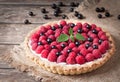 Raspberry tart pie with whipped cream, blackberry Royalty Free Stock Photo