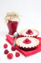 Raspberry tarts and jar of raspberry jam Royalty Free Stock Photo