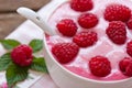 Raspberry yogurt in the bowl