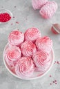 Raspberry zephyr, Russian marshmallows on a cake stand on a grey concrete background. Copy space, selective focus Royalty Free Stock Photo