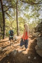 Rastafarian girl on a walk in a rocky forest Royalty Free Stock Photo