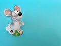 Rat football player with ball as a symbol of New 2020 year. Grey nice mouse on blue background with copy space for text and