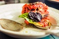 Ratatouille - a classic vegetarian dish from French cuisine. Baked vegetables in tomato sauce with basil and paprika. Close-up.