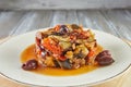 Ratatouille Ragout with zucchini, zucchini, eggplant, peppers and cherry tomatoes. Decorated with olives. French gourmet