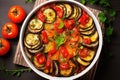 Ratatouille served in a bowl with fresh basil