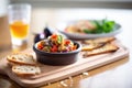 ratatouille served with crusty bread on wooden board