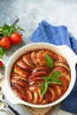 Ratatouille, vegetarian meal on a stone or slate table.