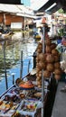 Floating water market in Ratchaburi, Thailand selling fruit and vegetables from their boats.