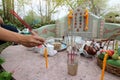 Ratchaburi, Thailand - April 4, 2017 : Thai people praying Ancestor Worshipping with Sacrificial offering in the Qingming Festival Royalty Free Stock Photo