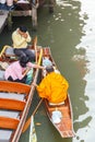 Ratchaburi ,Thailand - March 20 2016 : Buddhist monk on boat in morning at Damnoen Saduak Floating Market. Royalty Free Stock Photo