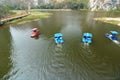 Ratchaburi , Thailand - March 10 , 2018 : Tourists spinning pedal boats on the lake at khao Ngu Stone Park