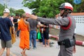 Ratchaburi, Thailand - October 18, 2016:Thai police support people and Buddhist monks in the end of Buddhist Lent Day.