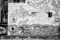 BW of graffiti walls by unknown artist at Chalermla Public Park on Phayathai Road