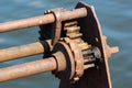 Ratchet and pawl mechanism of old rusty winch on a pier