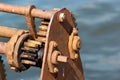 Ratchet and pawl mechanism of old rusty winch on a pier Royalty Free Stock Photo