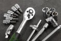 Ratchet set with heads, different socket wrenches close-up on a dark stone Royalty Free Stock Photo