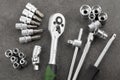 Ratchet set with heads, different socket wrenches close-up on a dark stone Royalty Free Stock Photo