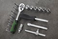 Ratchet set with heads, different socket wrenches close-up on a dark stone Royalty Free Stock Photo